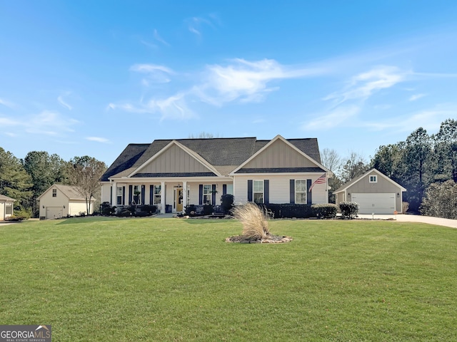 craftsman house with a garage, board and batten siding, concrete driveway, and a front lawn