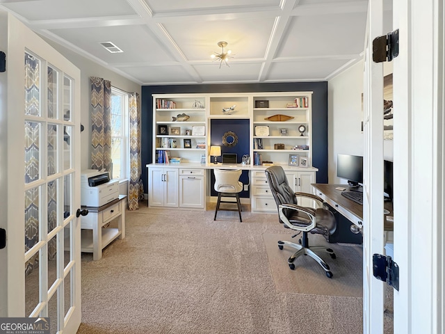 home office with visible vents, built in features, light carpet, french doors, and coffered ceiling