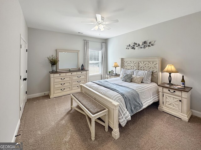 living area with a ceiling fan, baseboards, and light carpet