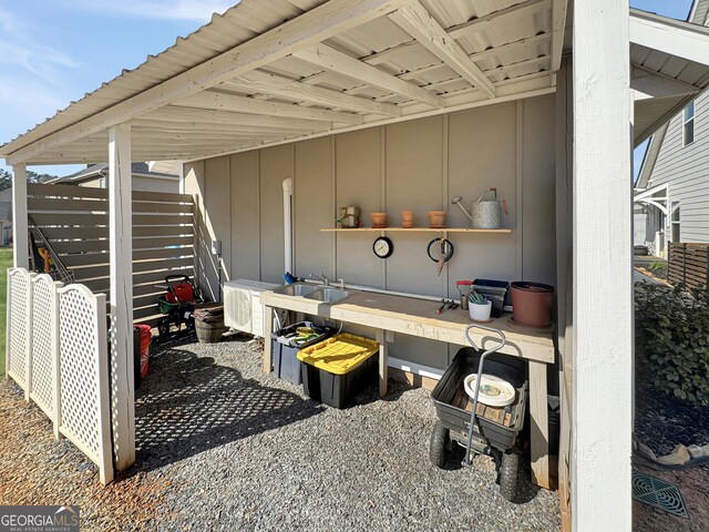 rear view of house with a yard, a sunroom, and a shingled roof