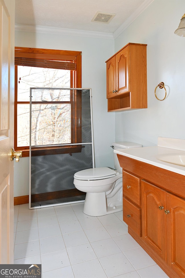 bathroom featuring toilet, visible vents, crown molding, and vanity