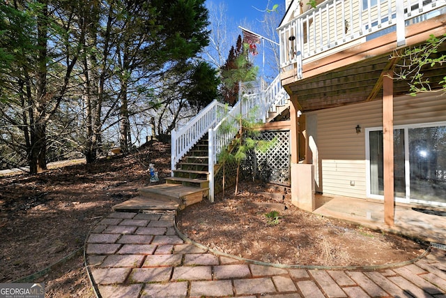 view of yard with stairway and a patio