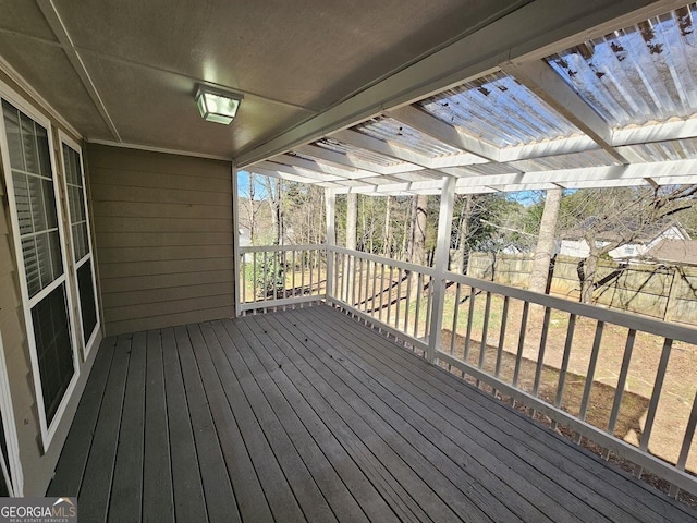 wooden deck with fence and a pergola