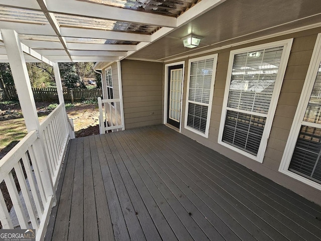 deck featuring fence and a pergola