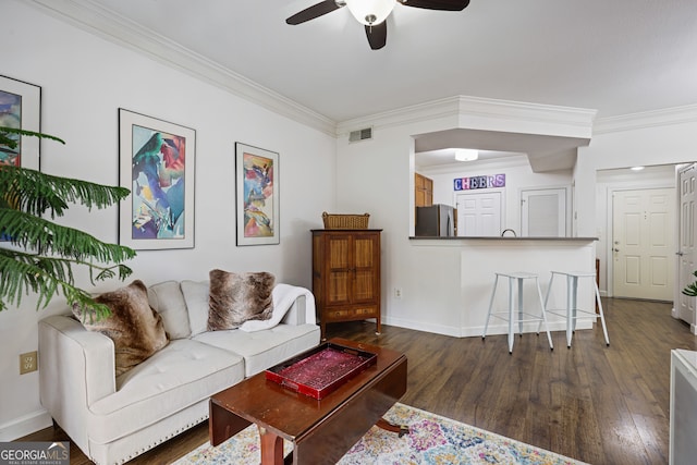 living area featuring ornamental molding, dark wood-style flooring, visible vents, and baseboards