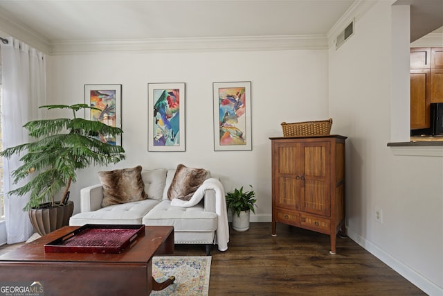 living area featuring dark wood-style floors, visible vents, ornamental molding, and baseboards