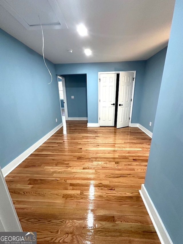 interior space featuring light wood-style floors and baseboards