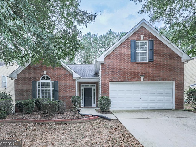 traditional-style house featuring driveway, brick siding, roof with shingles, and an attached garage