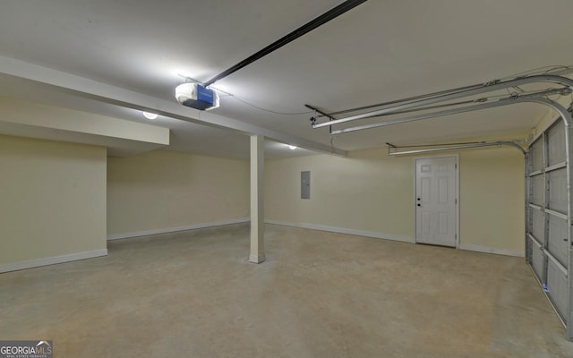 garage with baseboards, electric panel, and a garage door opener