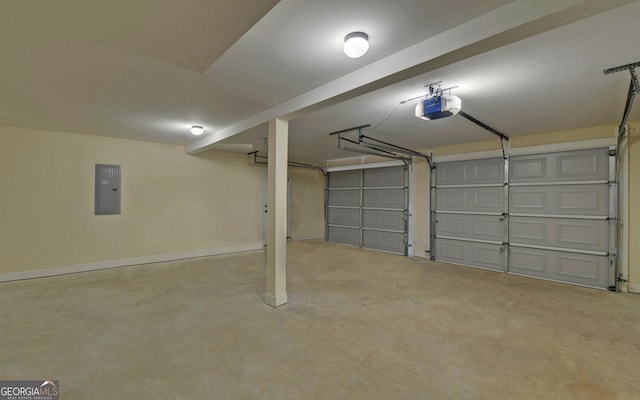 garage featuring baseboards, electric panel, and a garage door opener