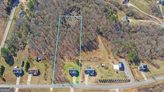 birds eye view of property featuring a rural view