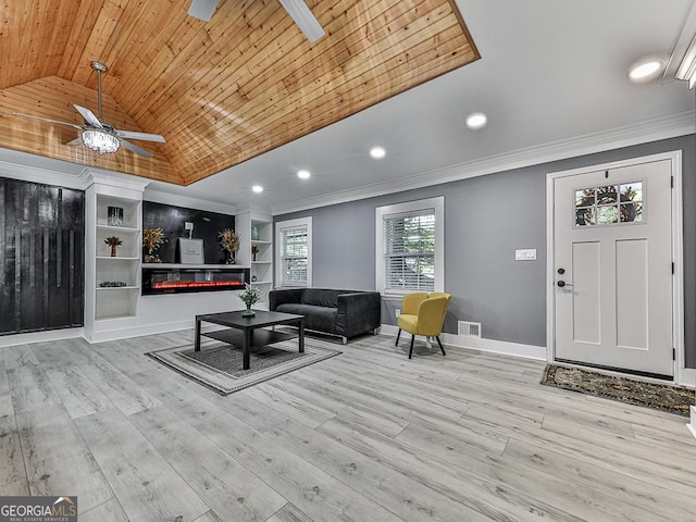 living room featuring ornamental molding, a glass covered fireplace, wood ceiling, and lofted ceiling