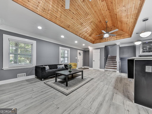 living room with visible vents, wood ceiling, stairs, a tray ceiling, and crown molding