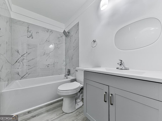 full bath featuring  shower combination, toilet, wood finished floors, and vanity