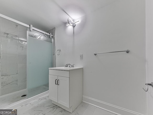 full bath with marble finish floor, baseboards, vanity, and a marble finish shower