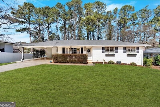 ranch-style house with a carport, driveway, a front lawn, and fence