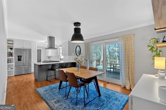 dining area with light wood-type flooring