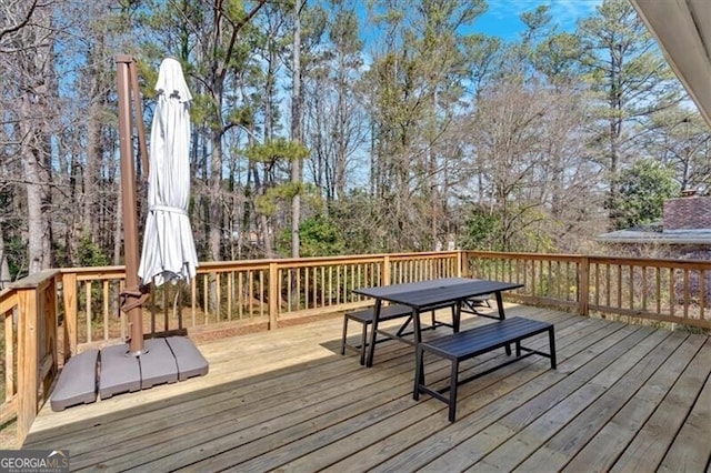 deck featuring outdoor dining area