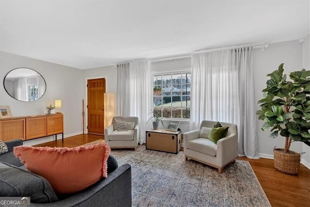 interior space featuring wood finished floors and baseboards