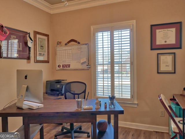 home office with crown molding, baseboards, and wood finished floors