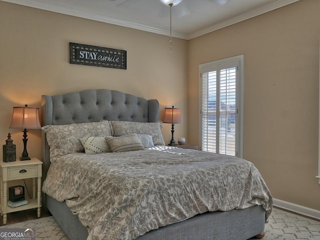 bedroom with baseboards and crown molding