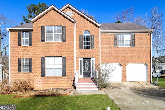 view of front facade featuring a garage, driveway, and brick siding