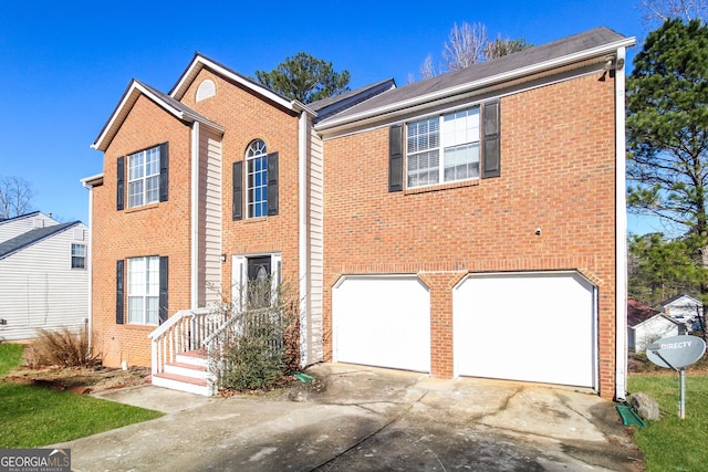 view of front of property featuring brick siding, driveway, and an attached garage