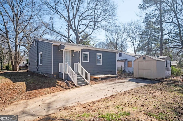 view of front of house featuring crawl space, an outdoor structure, and a storage shed