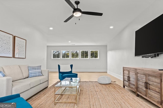 living area with a ceiling fan, light wood-type flooring, baseboards, and recessed lighting