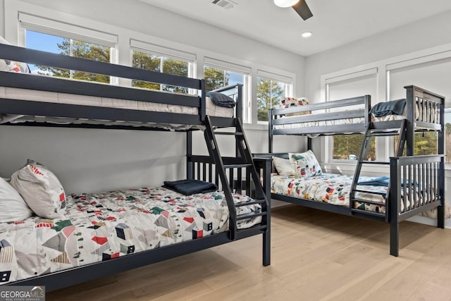 bedroom with ceiling fan, light wood finished floors, visible vents, and recessed lighting