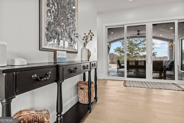 entryway with light wood-type flooring and recessed lighting