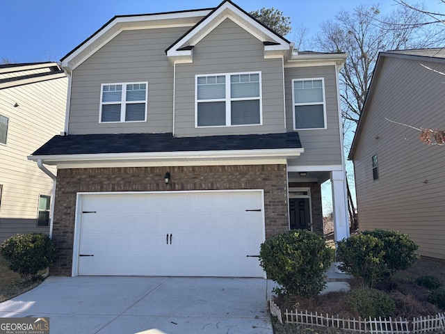 view of front facade with a garage, concrete driveway, and brick siding