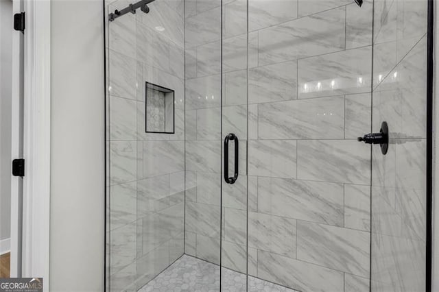 full bath featuring a shower stall