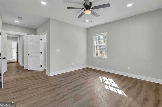 interior space with visible vents, baseboards, dark wood-style floors, ceiling fan, and recessed lighting