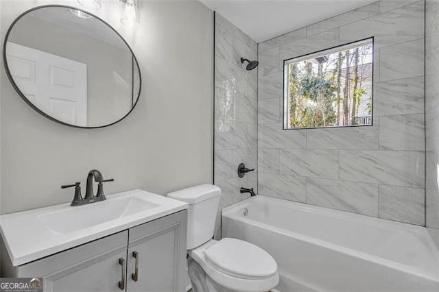 full bath featuring toilet,  shower combination, and vanity