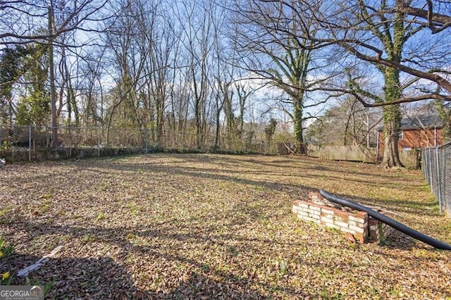 view of yard featuring fence