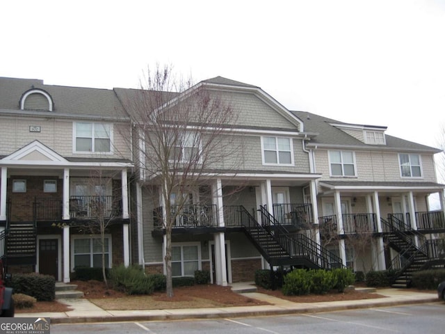 1035 Barnett Shoals Rd Unit 111, Athens, GA 30605 - view of front of property featuring stairs and uncovered parking