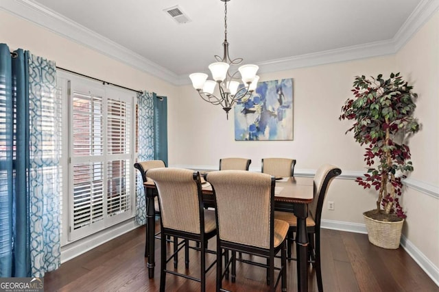 dining space featuring dark wood-style floors, visible vents, a chandelier, and crown molding