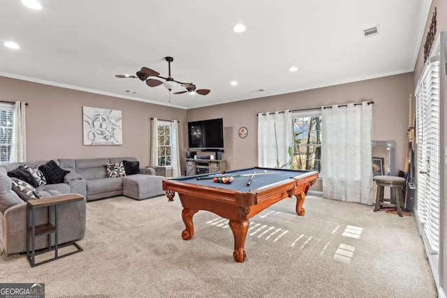 recreation room with recessed lighting, a healthy amount of sunlight, light carpet, and crown molding