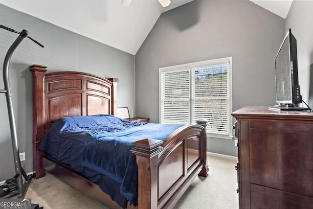 bedroom featuring a ceiling fan, light colored carpet, vaulted ceiling, and baseboards