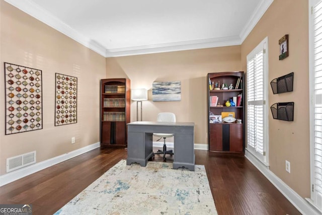 home office featuring baseboards, visible vents, dark wood-type flooring, and crown molding