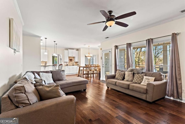 living room featuring dark wood-style flooring and crown molding