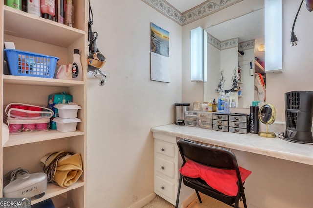 office area with baseboards and built in desk