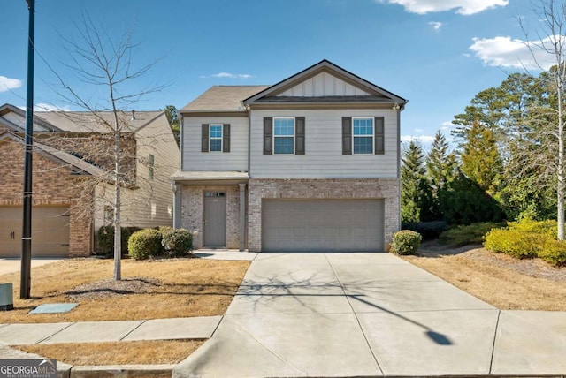 view of front of home with a garage, driveway, brick siding, and board and batten siding