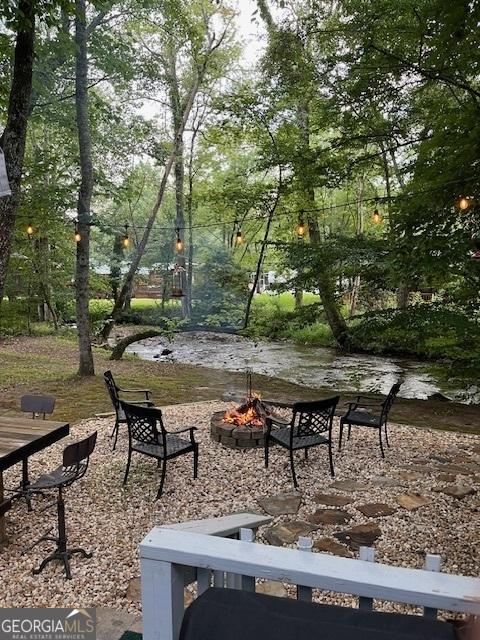 view of home's community with a fire pit