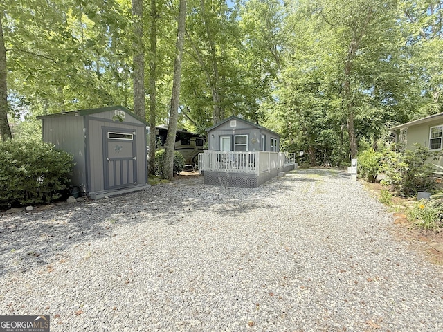 527 Hidden Valley Rd Unit 189, Cleveland, GA 30528 - view of front facade with a wooden deck and view of scattered trees