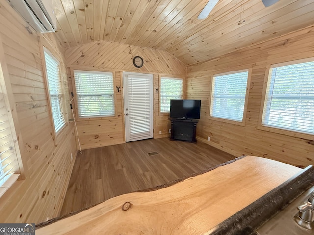 527 Hidden Valley Rd Unit 189, Cleveland, GA 30528 - unfurnished bedroom with wooden walls, lofted ceiling, wood finished floors, and a wall mounted air conditioner