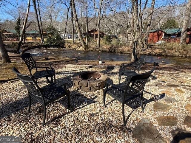 view of patio featuring an outdoor fire pit