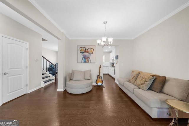 living room featuring stairway, wood finished floors, ornamental molding, and a chandelier