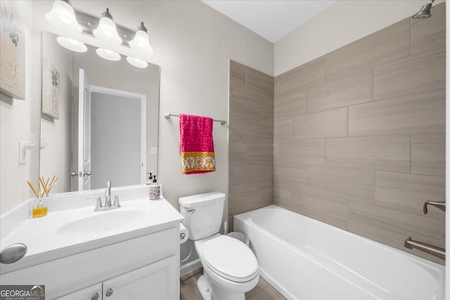 full bathroom with bathing tub / shower combination, toilet, and vanity